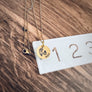 Necklace round charm disc showing 5/8 inch in diameter