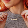 Yellow gold engraved turtle bar necklace