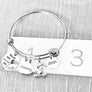 bracelet on ruler to show 2.5 inch wide
