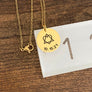yellow gold necklace on ruler to show measurement