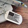 silver stainless steel dog tag keychain with a fishing symbols as the stripes on the american flag image