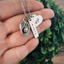 necklace on womans hand to show perspective