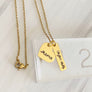 yellow gold necklace on ruler to show measurements