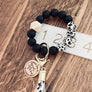 cow print wristlet on ruler to show measurements