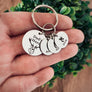keychain on woman's hand to show perspective