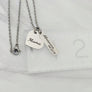 silver necklace on ruler to show measurements