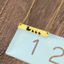 duck necklace on ruler to show 1.25" wide
