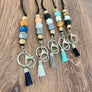 all 5 color options, boho, coral, black, turquoise, and cheetah lanyards