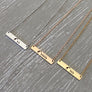 Mama Giraffe with 2 babies engraved on silver bar necklace. Mama Giraffe with 5 babies engraved on rose gold bar necklace. Mama Giraffe with 3 babies engraved on yellow gold bar necklace.