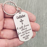 keychain on womens hand to show size