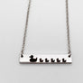 Silver duck necklace engraved with mom duck and 5 baby ducklings attached to a cable chain with lobster clasp
