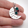 silver moon in womans hand to show size