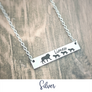 Silver Horizontal bar necklace engraved with 1 mom lion and 3 lion baby cubs