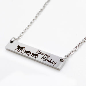 silver mommy monkey horizontial bar necklace with baby monkies