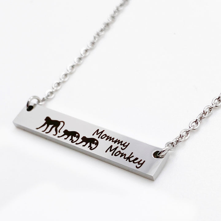 silver mommy monkey horizontial bar necklace with baby monkies