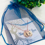rose gold initial necklace in stamps of love packaging