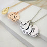 Silver 3 disc round pendant mothers necklace with J and the date 7.29.87, C with the date , and T with the date of birth. Roe Gold necklace with 2 initial discs I and B with date of births. Yellow Gold with childs initial e and date of birth