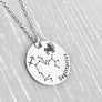 silver stainless steel 7/8" disc engraved with Sagittarius, its constellation, symbol, and the Archer or Centaur attached to a stainless steel cable chain with lobster clasp