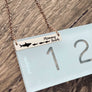 bar necklace on ruler to show 1 3/8"