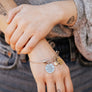 silver teacher bangle charm bracelet with engraved "the influence of a great teacher can never be erased" an apple charm and a 3/4" heart engraved with teachers name "mrs Peppers"