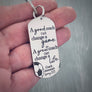 keychain on woman's hand to show size