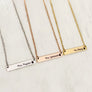 Silver, Rose Gold, and Yellow Gold stainless steel horizontal bar necklace engraved with teacher's name and an apple charm. attached to a stainless steel cable chain