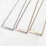Silver, Rose Gold, and Yellow Gold stainless steel horizontal bar necklace engraved with teacher's name and an apple charm. attached to a stainless steel cable chain