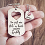keychain and heart charm necklace on woman's hand to show size