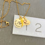 yellow gold necklace on ruler to show measurement