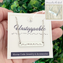 morse code bar necklace showing the custom engraved personal message on the back of the necklace "You got this!"