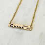 mama wolf engraved gold bar necklace with 4 baby wolves
