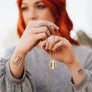 women holding necklace