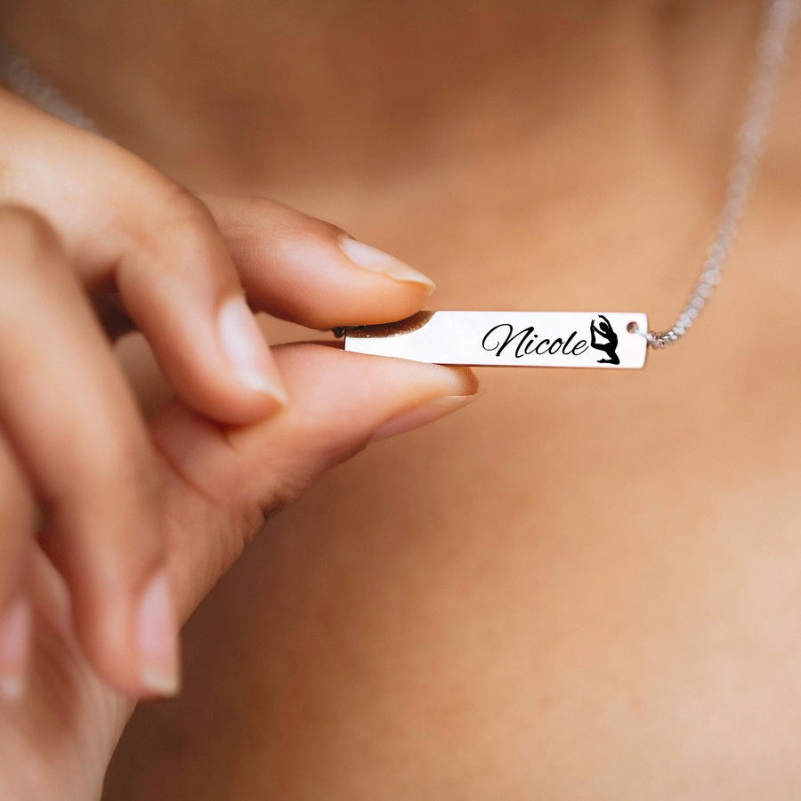 Engraved Silver bar necklace engraved and customized with the athlete’s name nicole and a image of a dancer
