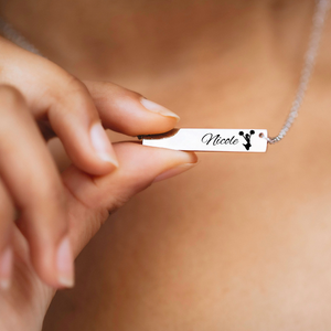 Silver bar necklace engraved and customized with the athlete’s name Nicole and a cheerleader image
