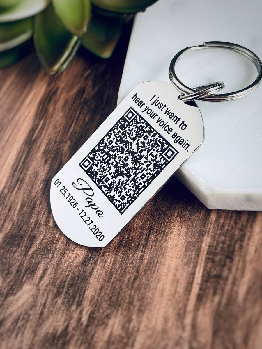 silver dog tag keychain on round keyring with memorial phrase I just want to hear your voice again and a qr code. papo and date of birth and death date