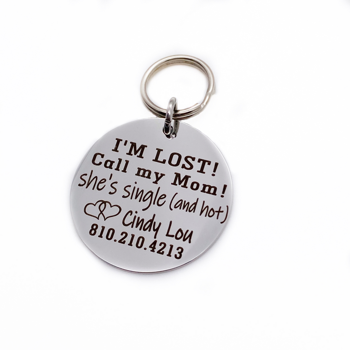 Silver stainless steel dog collar id tag with black engraving "I'M Lost! Call my mom! She's single (and hot) with a picture of a licking dog, pets name and telephone number
