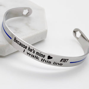 stainless steel police badge cut out cuff bracelet with thin blue line and engraved with because he's mine I walk this line with badge number