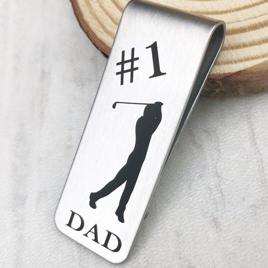 1 inch X 2 inch money clip engraved with #1 Dad and golfer silhouette 