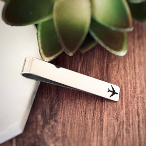 silver stainless steel tie clip engraved with an airplane jet liner