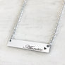 Shiny silver bar necklace engraved with auntie and a heart attached to a cable chain