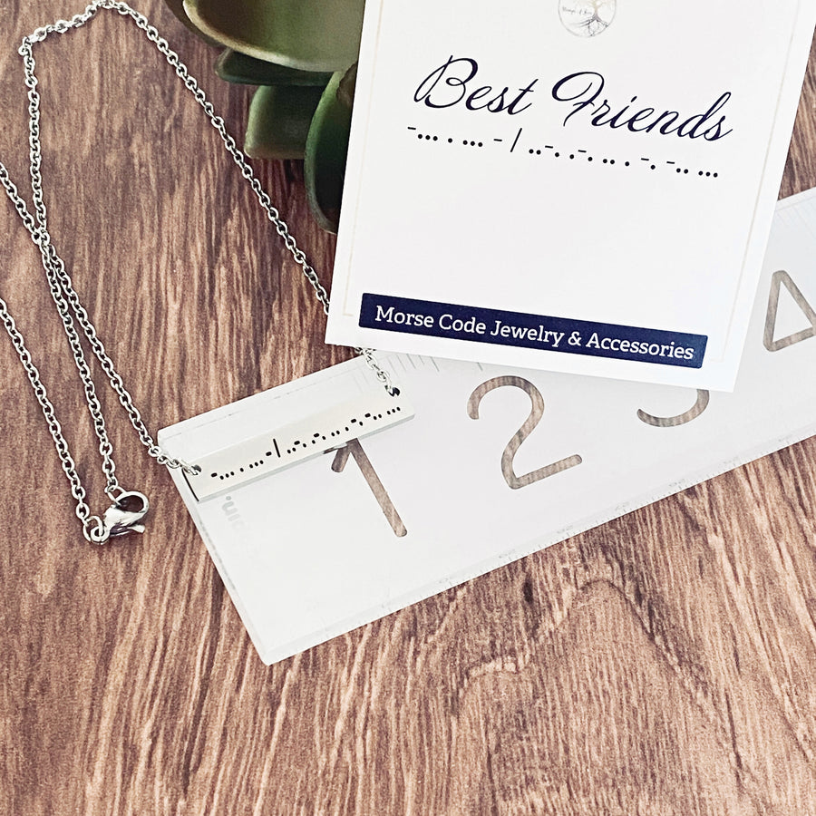 Silver Engraved Best Friend Morse code necklace on ruler to show measurement