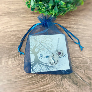 necklace packaged in a blue organza gift bag from stamps of love