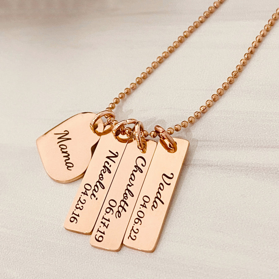 Rose gold necklace with 3 rectangle name tags. first charm with "Nikolai 4.23.16". second tag "charlotte 6.17.19". 3rd charm with "Vada 4.6.22"