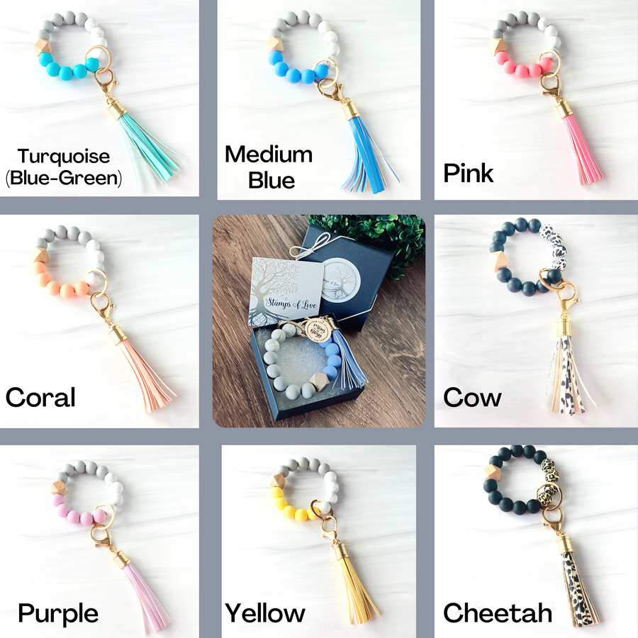 silicone beaded keychain wristlet color options. Turquoise, medium blue, pink, coral, purple, yellow, cheetah, and cow