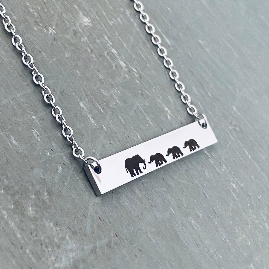 Mama Elephant with 3 babies engraved on silver bar necklace.