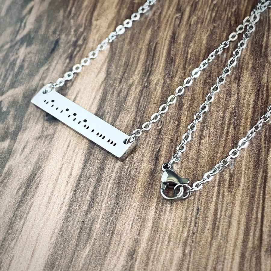 Shiny silver stainless steel "Fearless" morse code bar necklace with lobster clasp closure