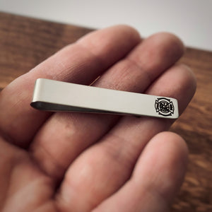 tie clip in woman's hand to show perspective 