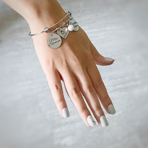 future mrs silver engraved bracelet worn on wrist by model