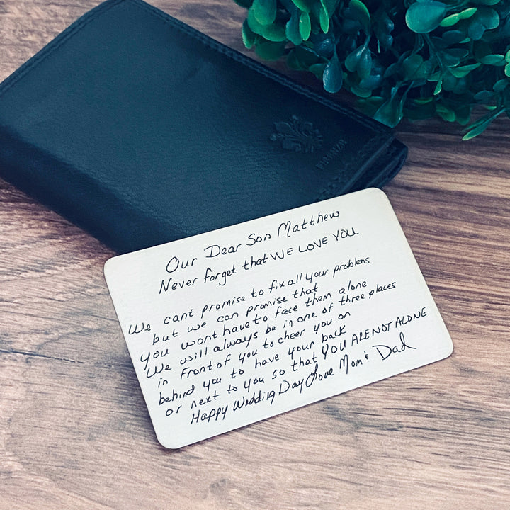 engraved handwriting note from mom and dad. Handwriting note engraved on a wallet card insert.