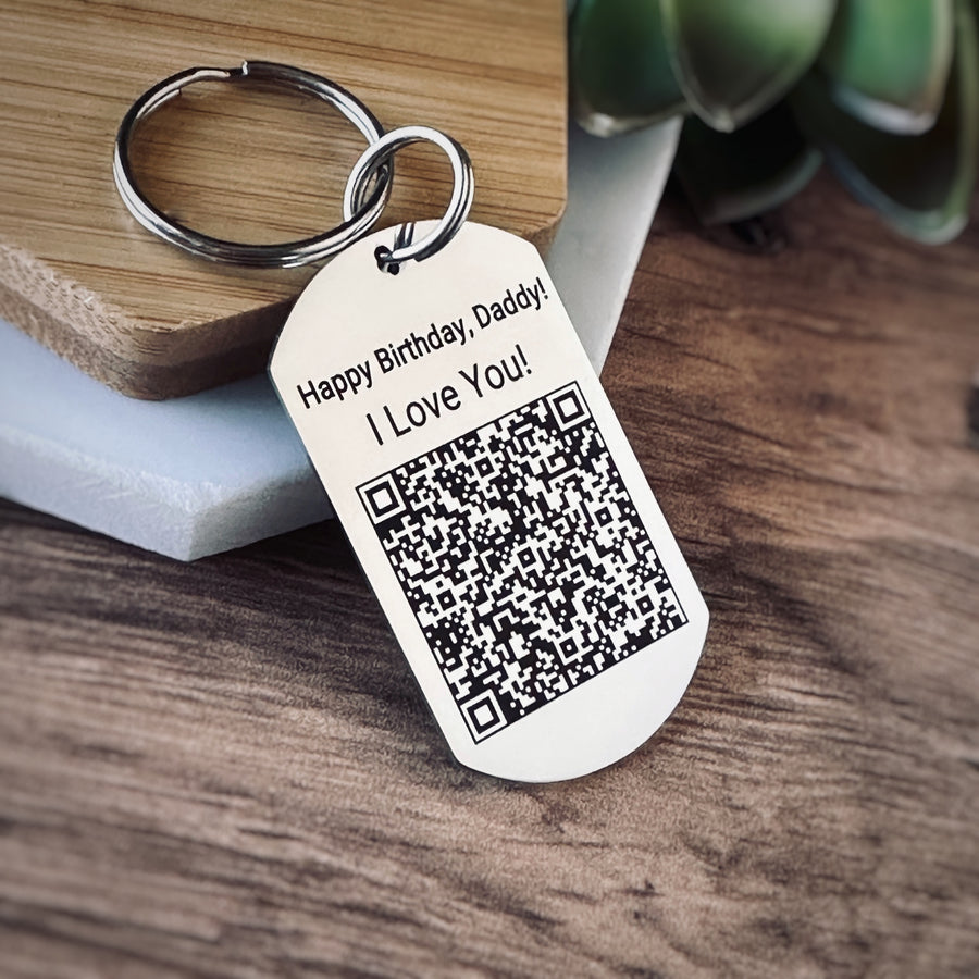 dog tag engraved with a qr code and Happy Birthday Daddy, I love you. Attached is a stainless steel 1 inch round keyring